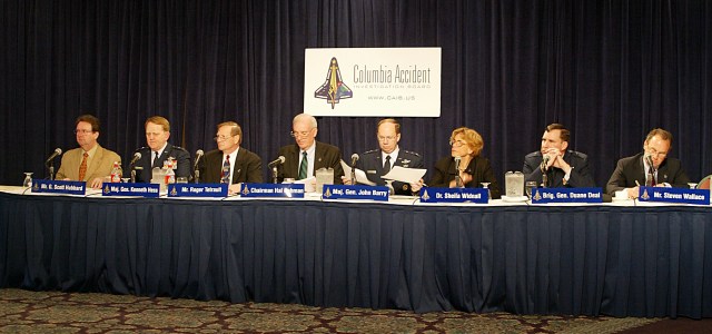 The CAIB panel sits behind a table for the May 6, 2003 public hearing