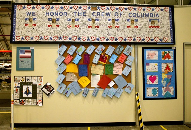 Bulletin boards on a wall covered in cards and letters from children.