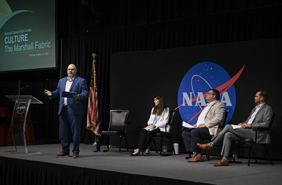 From left, Joseph Pelfrey, acting director at NASAs Marshall Space Flight Center, talks during an all-hands meeting on Aug. 15, while Rae Ann Meyer and Larry Leopard, associate directors, and Jeramie Broadway, center strategy lead, listen.