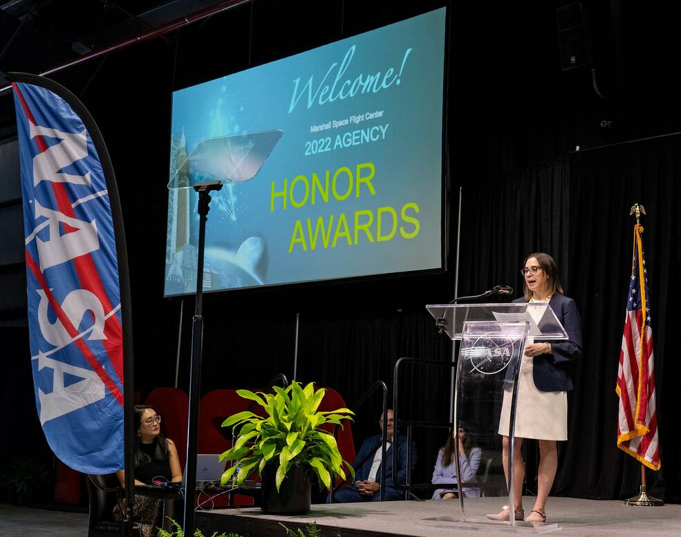 Dr. Makenzie Lystrup, left, director of NASAs Goddard Space Flight Center, gives the keynote presentation during the agency honor awards in Activities Building 4316.