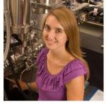 Portrait photo of Claire Ricketts standing in an astrophysics laboratory at NASA Ames.