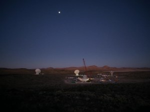 In the early morning of Dec. 18, 2024, a crane looms over the 112-foot-wide (34-meter-wide) steel framework for Deep Space Station 23 reflector dish, which will soon be lowered into position on the antenna’s base structure.