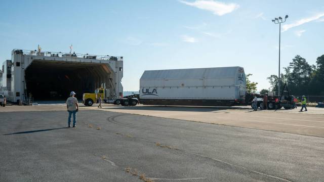ULA crews guide the ICPS (interim cryogenic propulsion stage) for NASAs SLS (Space Launch System) rocket to the loading dock and awaiting barge in Decatur, Alabama, for shipment to Florida, July 31.