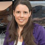 Jennifer L Eigenbrode wearing a purple shirt with a white undershirt.