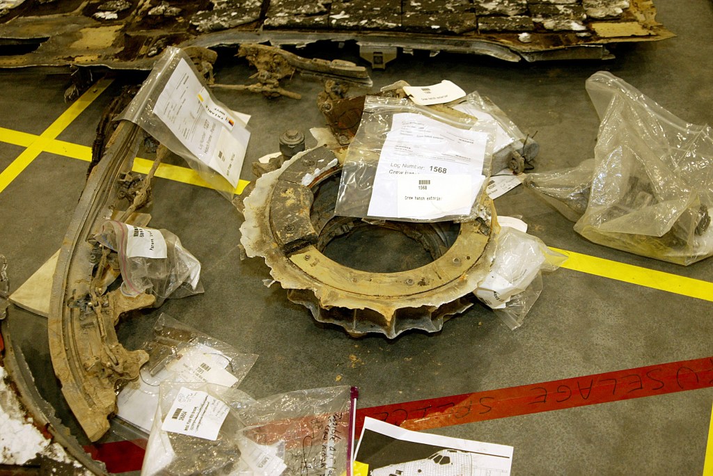 Debris laid on the Columbia reconstruction hangar floor
