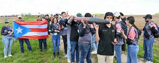 Students from the University of Puerto Rico, Mayaguez Campus, carry their rocket to the launch pad during the 2023 Student Launch event. NASA is accepting student team proposals for the 2024 season until Sept. 11.