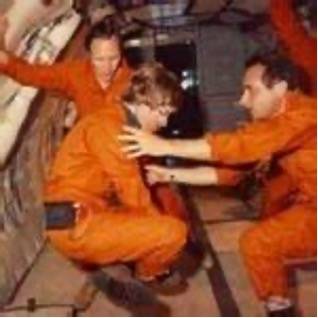 Three astronauts doing tests for medical issues in low gravity
