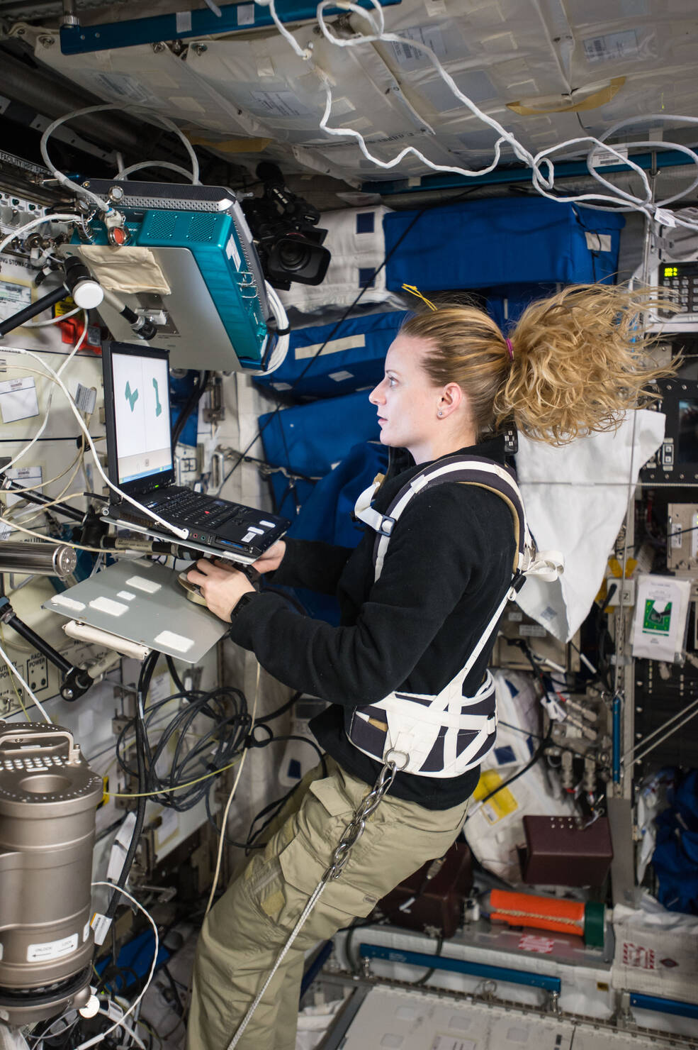 NASA astronaut Kate Rubins conducts a session for the Neuromapping investigation using a laptop computer on the ISS.