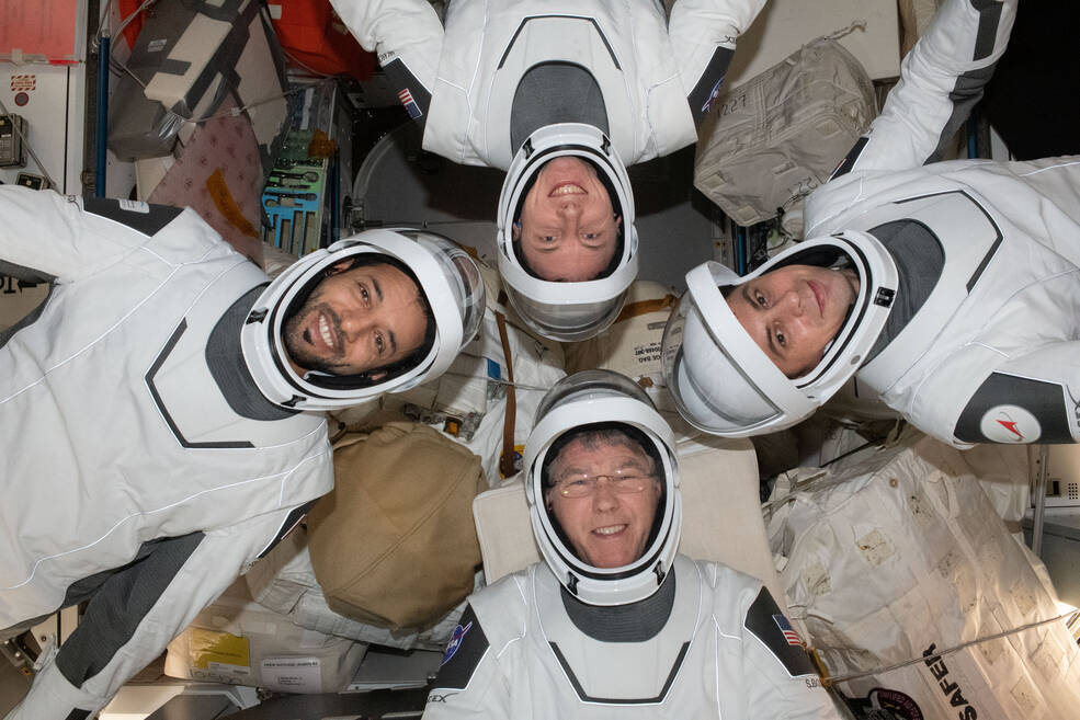 Crew-6 crew poses in a circle in pressure suits on station. Clockwise from bottom are NASA astronaut Stephen Bowen; UAE astronaut Sultan Alneyadi; NASA astronaut Woody Hoburg; u0026amp; Roscosmos cosmonaut Andrey Fedyaev.