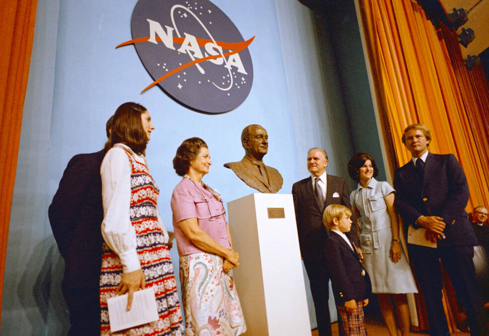 Mrs. Johnson and family members pose with James E Webb