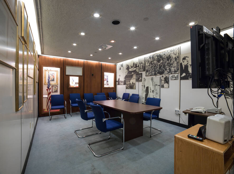 Documents and memorabilia line the walls of the conference room in the LBJ Room 