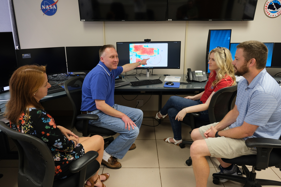 From left, Kelley Murphy, Dan Dixon, Huntir Cramer and Dr. Andrew White discuss how SPoRT's Lightning-AI product performed for Rock the South.