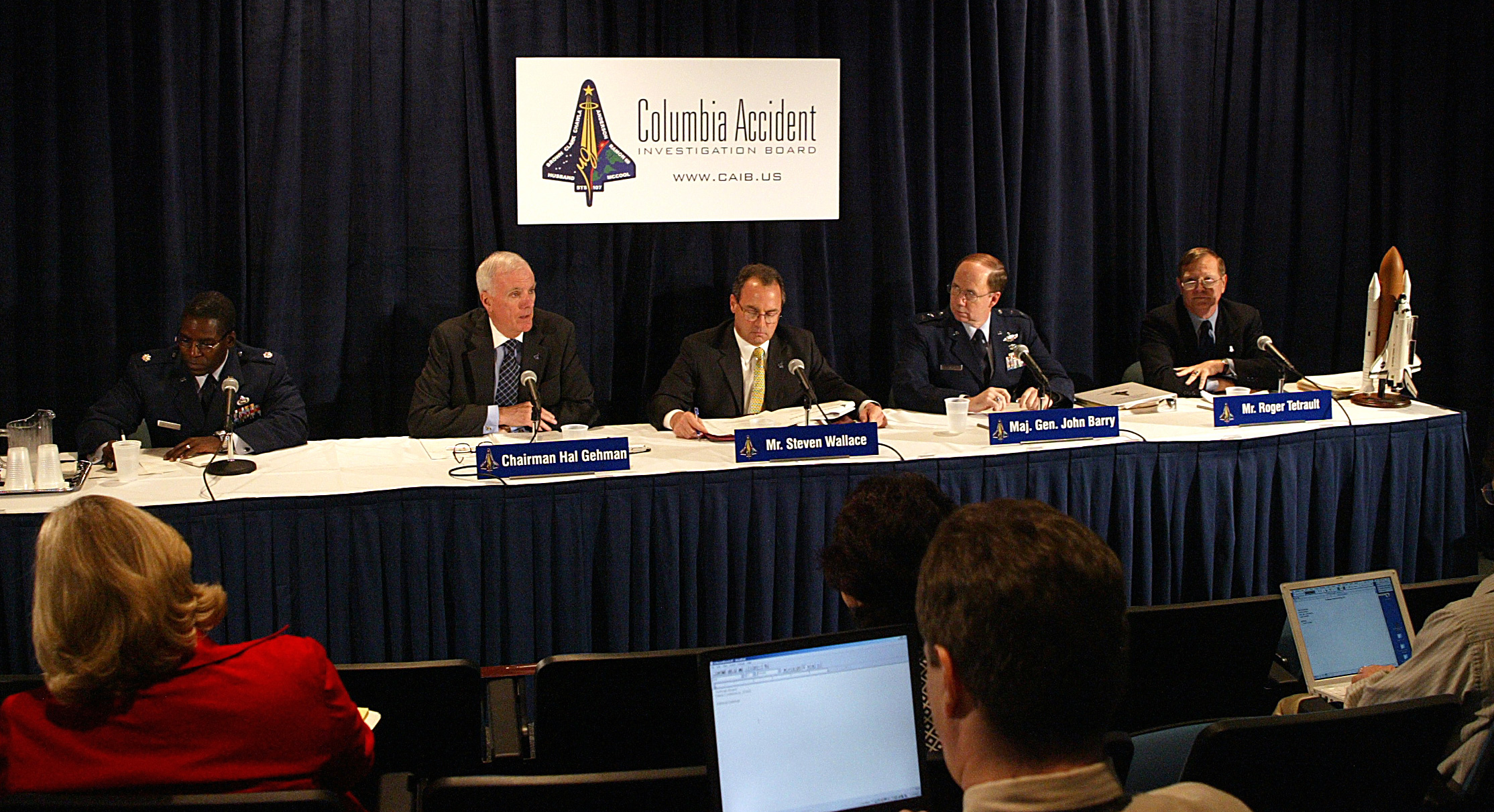 Representatives of CAIB speak at a press briefing