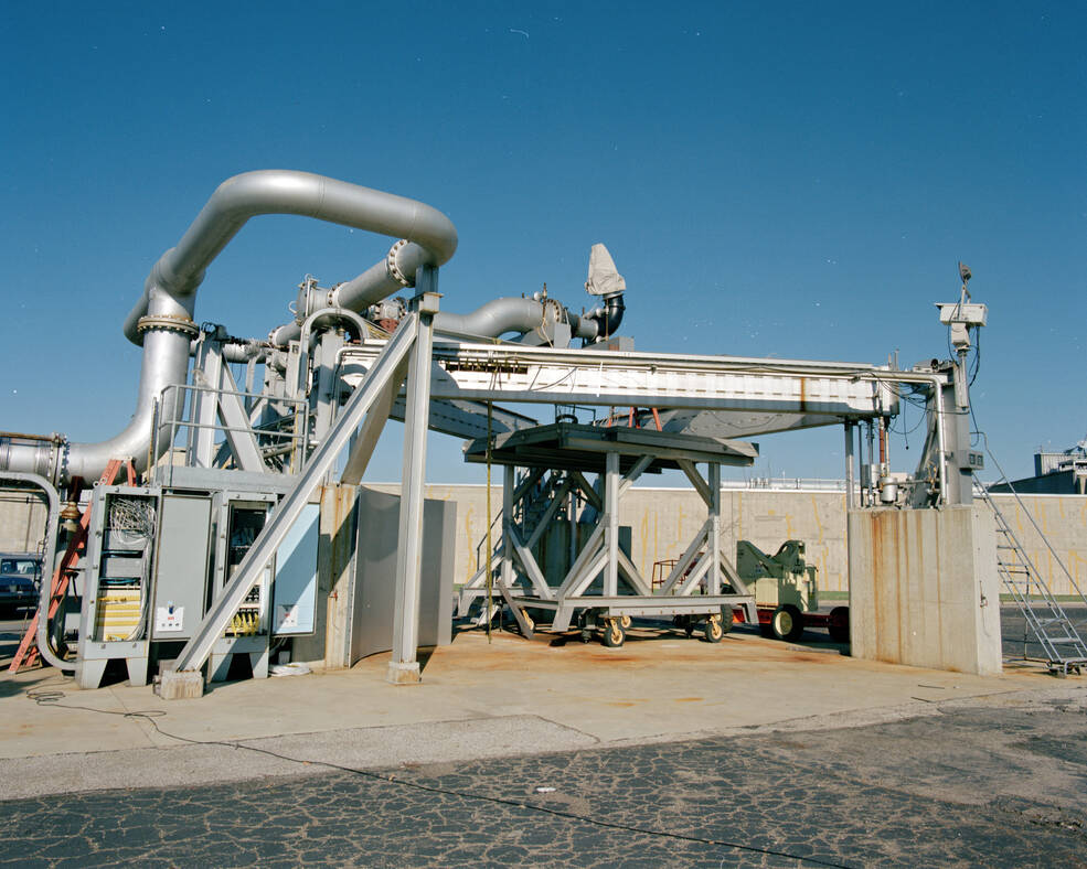 Metal hardware, pipes, and machinery for the Powered Lift Facility, pictured outside on NASA Glenns campus.