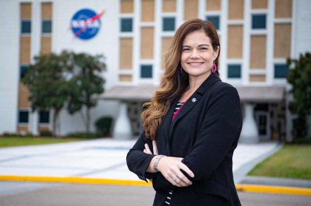 Sallie Bilbo stands in front of Building 1100 at Stennis Space Center
