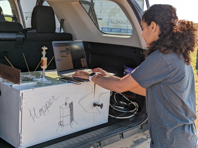 A woman conducts software testing on the Micro-Nova Hopper