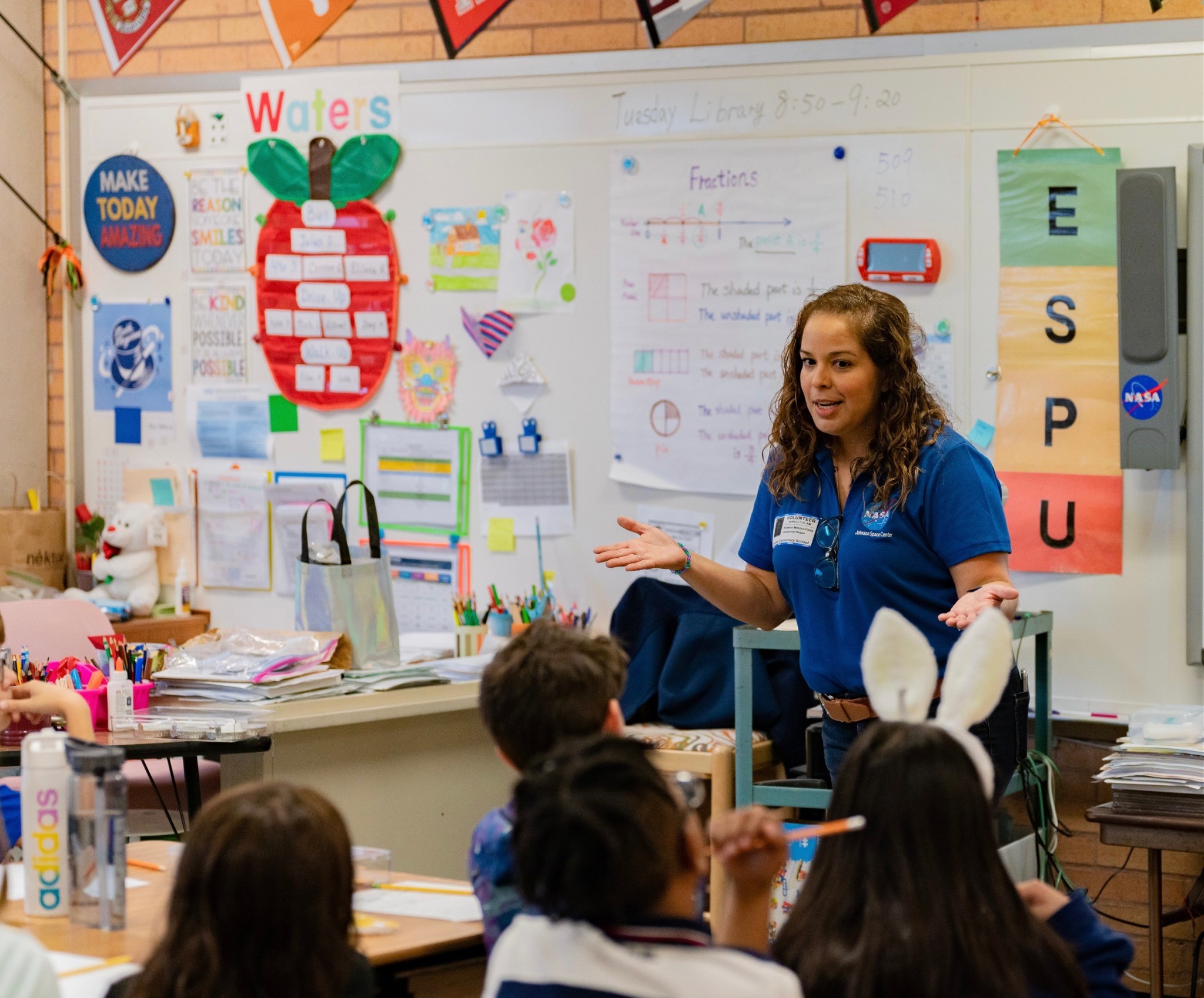 NASA female employee speaking to students