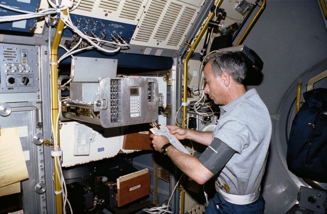 Mission Specialist Carl Meade reviewing procedures and working in the mid section of the U. S. Microgravity Laboratory-1 with the Generic Bioprocessing Apparatus, rack # 10.