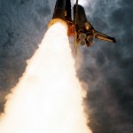 STS-50 Columbia, OV-102, soars into the sky after KSC liftoff