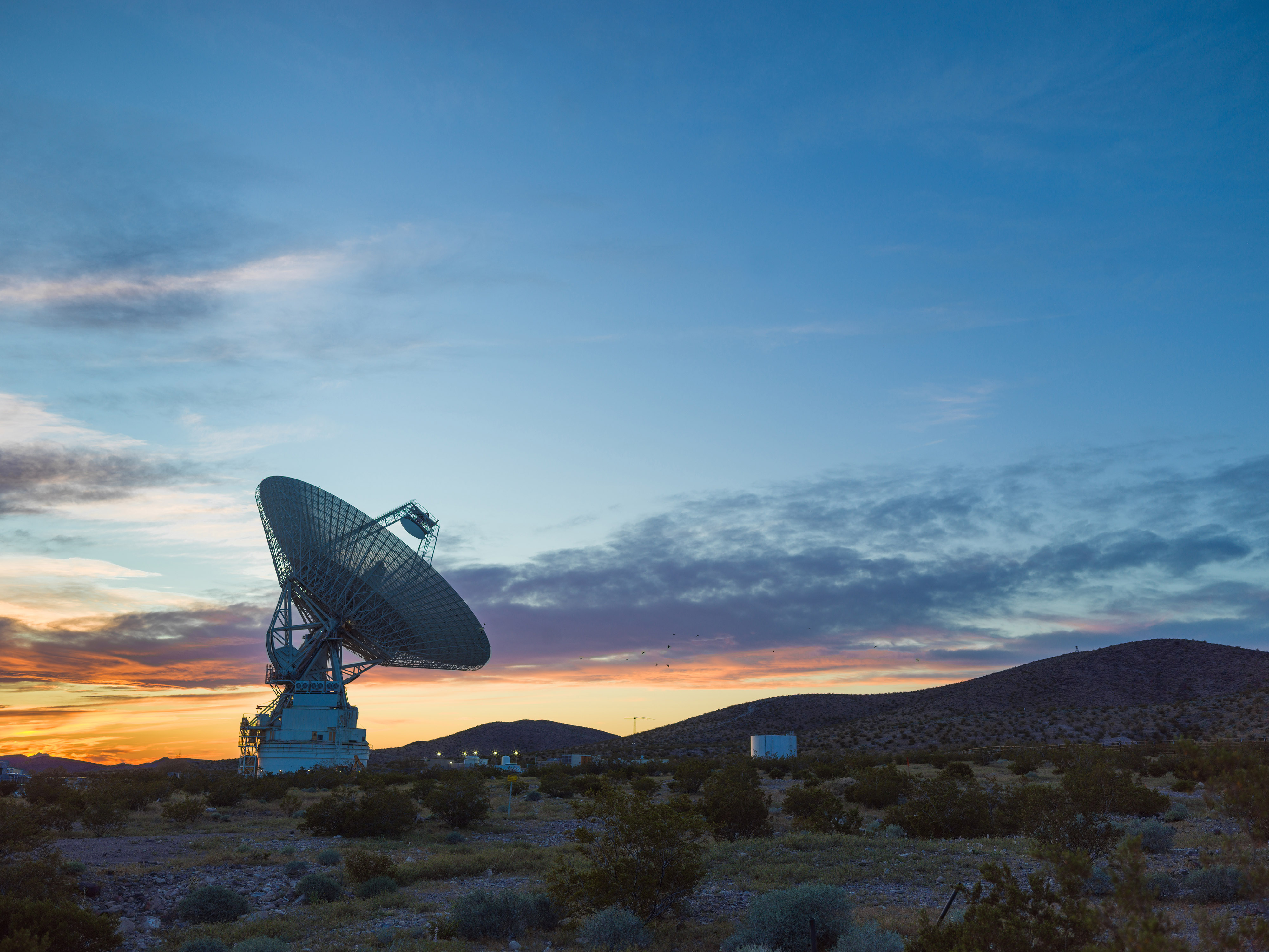 This sunset photo shows Deep Space Station 14 (DSS-14), the 230-foot-wide (70-meter) antenna at the Goldstone Deep Space Communications Complex near Barstow, California, part of NASA's Deep Space Network. The network's three complexes around the globe support communications with dozens of deep space missions. DSS-14 is also the agency's Goldstone Solar System Radar, which is used to observe asteroids that come close to Earth.