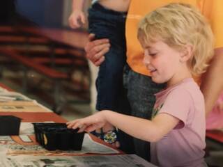 Loral O'Hara in the second grade planting tomato seeds that had flown on Space Shuttle.