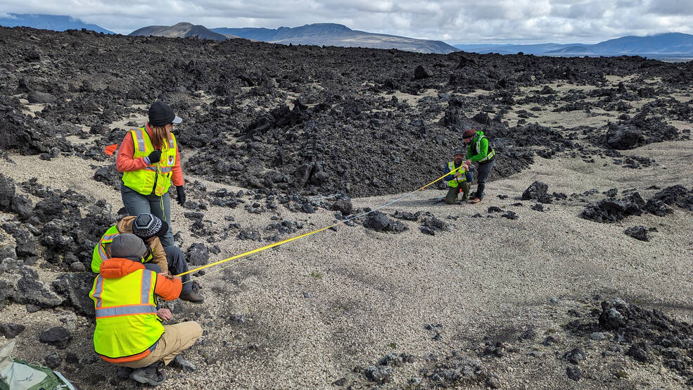 Members of the international VERITAS science team prepare for lidar (Light Detection and Ranging) imaging of rocks in Iceland.