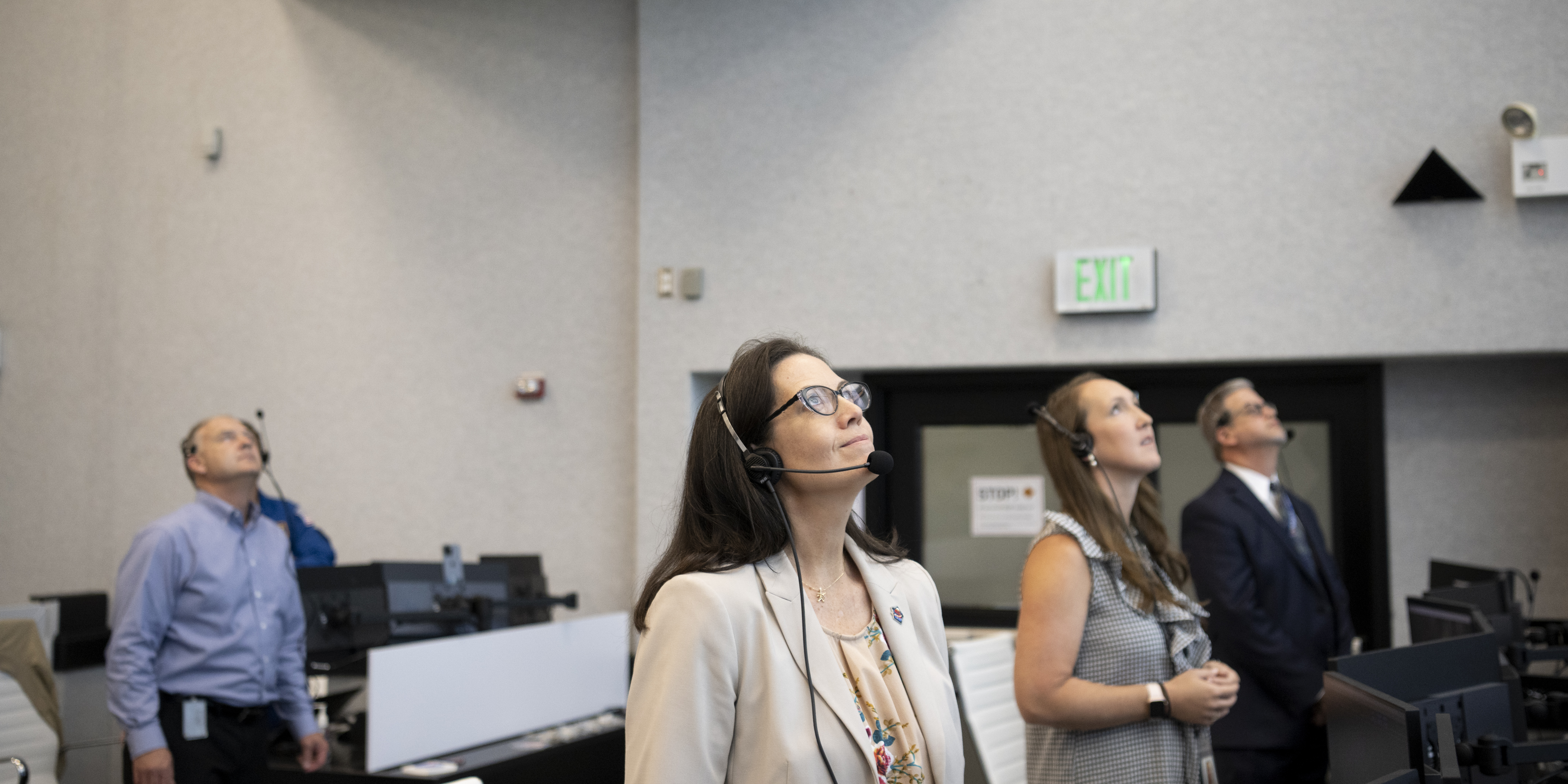 NASA's Chief Flight Director, Emily Nelson, monitors the launch of a SpaceX Falcon 9 rocket carrying the company's Crew Dragon spacecraft on the Crew-5 mission.