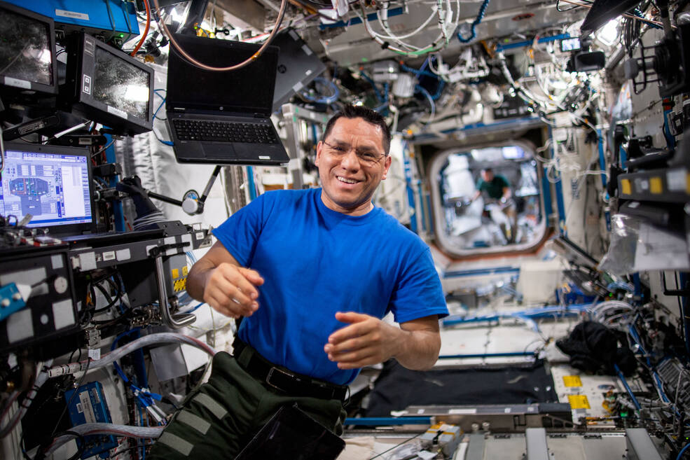 NASA astronaut and Expedition 69 Flight Engineer Frank Rubio poses for a portrait while working inside the International Space Station's Destiny laboratory module.