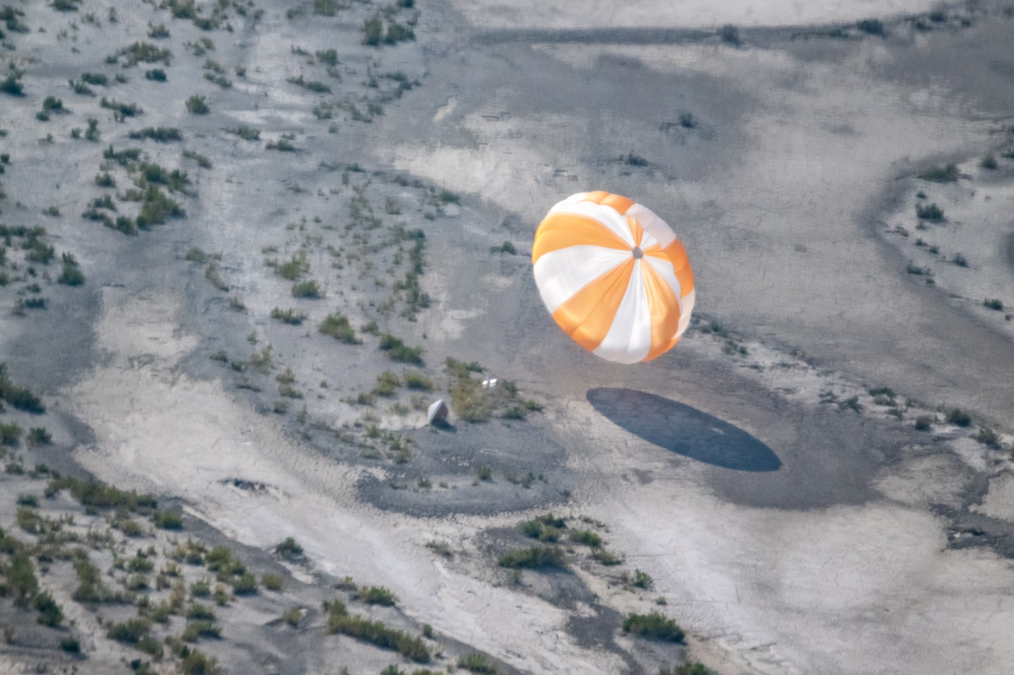 The mission’s sample return capsule will land with aid of a parachute – like the training model shown here in an Aug. 30 test – on Sept. 24 at the Department of Defense's Utah Test and Training Range in the desert outside Salt Lake City.