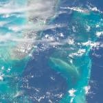The teal and deep blue waters of The Bahamas are seen from the International Space Station as it orbited roughly 260 miles above. To the left of the image, the Andros island can be seen, while Nassau is shown to the right.