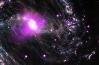 The center of the spiral galaxy NGC 1365 contains a supermassive black hole being fed by a steady stream of material.