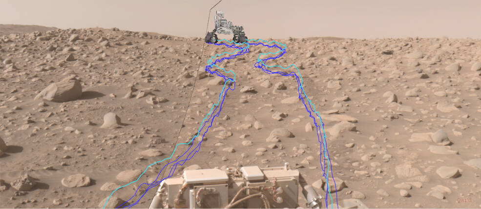 This composite image shows Perseverances path through a dense section of boulders. The pale blue line indicates the course of the center of the front wheel hubs, while darker blue lines show the paths of the rovers six wheels.