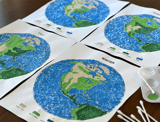 Four artistic representations of Earth’s Northern Hemisphere illustrating vegetation changes during each of the four seasons