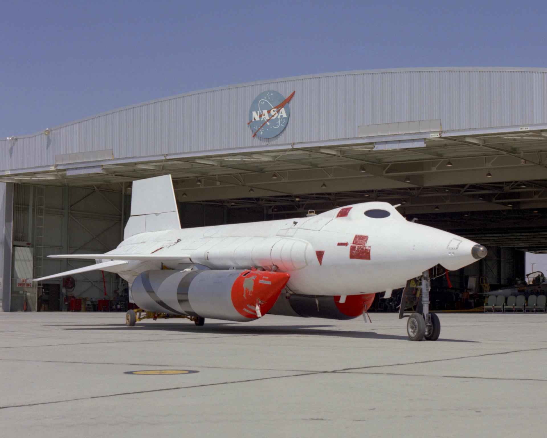 X-15A-2 with ablative coating and external tanks installed parked in front of hangar.
