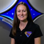 A portrait of Kennedy Space Center's Genevieve Futch with the Launch Services Program insignia in the background.