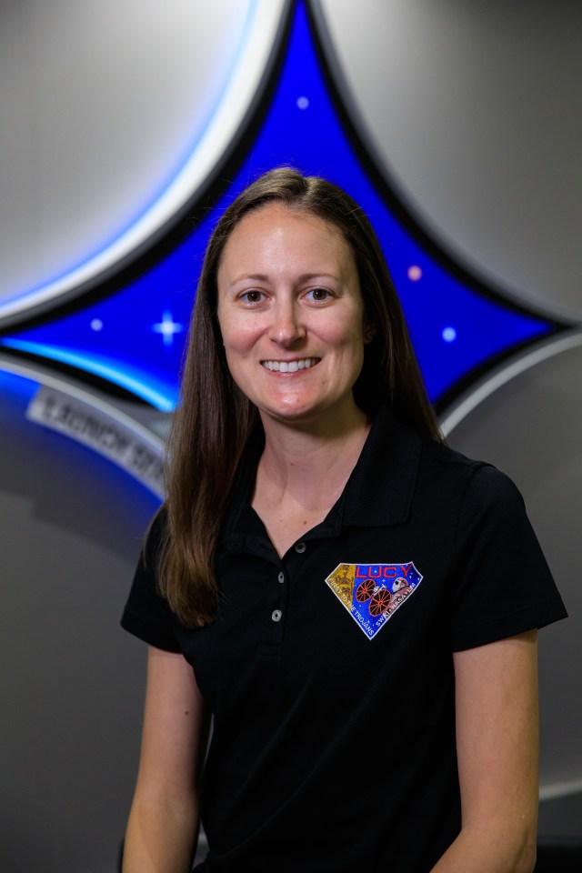 A portrait of Kennedy Space Center's Genevieve Futch with the Launch Services Program insignia in the background.