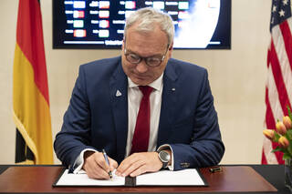 Director General of the German Space Agency at the German Aerospace Center (DLR) Walther Pelzer signs the Artemis Accords, Thursday, September 14, 2023, at the German Ambassadors Residence in Washington.
