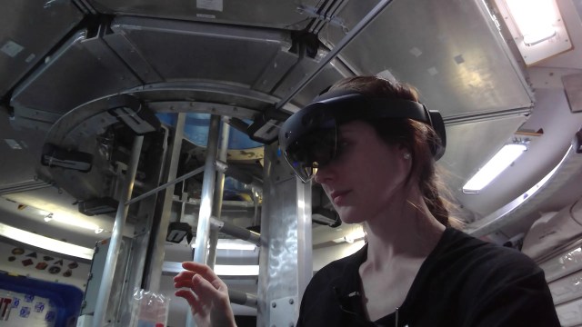 Inside Campaign 6 Mission 1 of NASA’s Human Exploration Research Analog, or HERA, crew member Lauren Cornell dons a pair of augmented reality goggles. She’s using the goggles in one of her mission tasks aimed at improving human performance in a spaceflight-like environment.