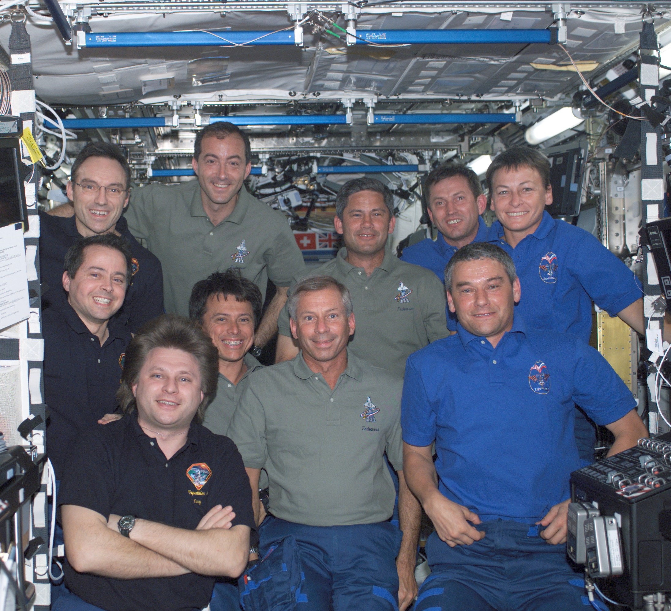 NASA astronaut Franklin R. Chang-Díaz with his STS-111 crewmates and the Expedition 4 and 5 crews