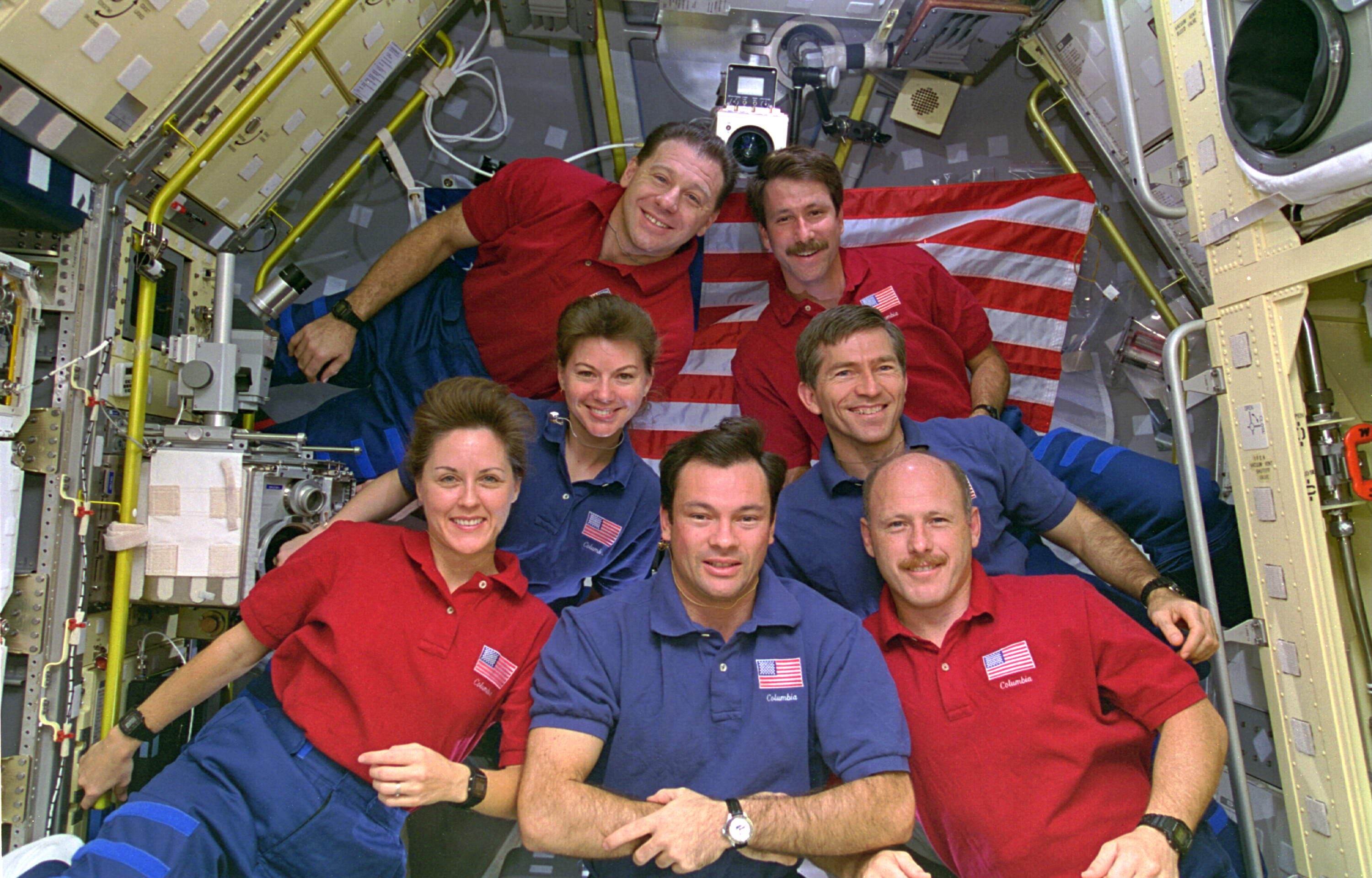 Michael E. Lopez-Alegria with the rest of the STS-73 crew inside the Spacelab module.