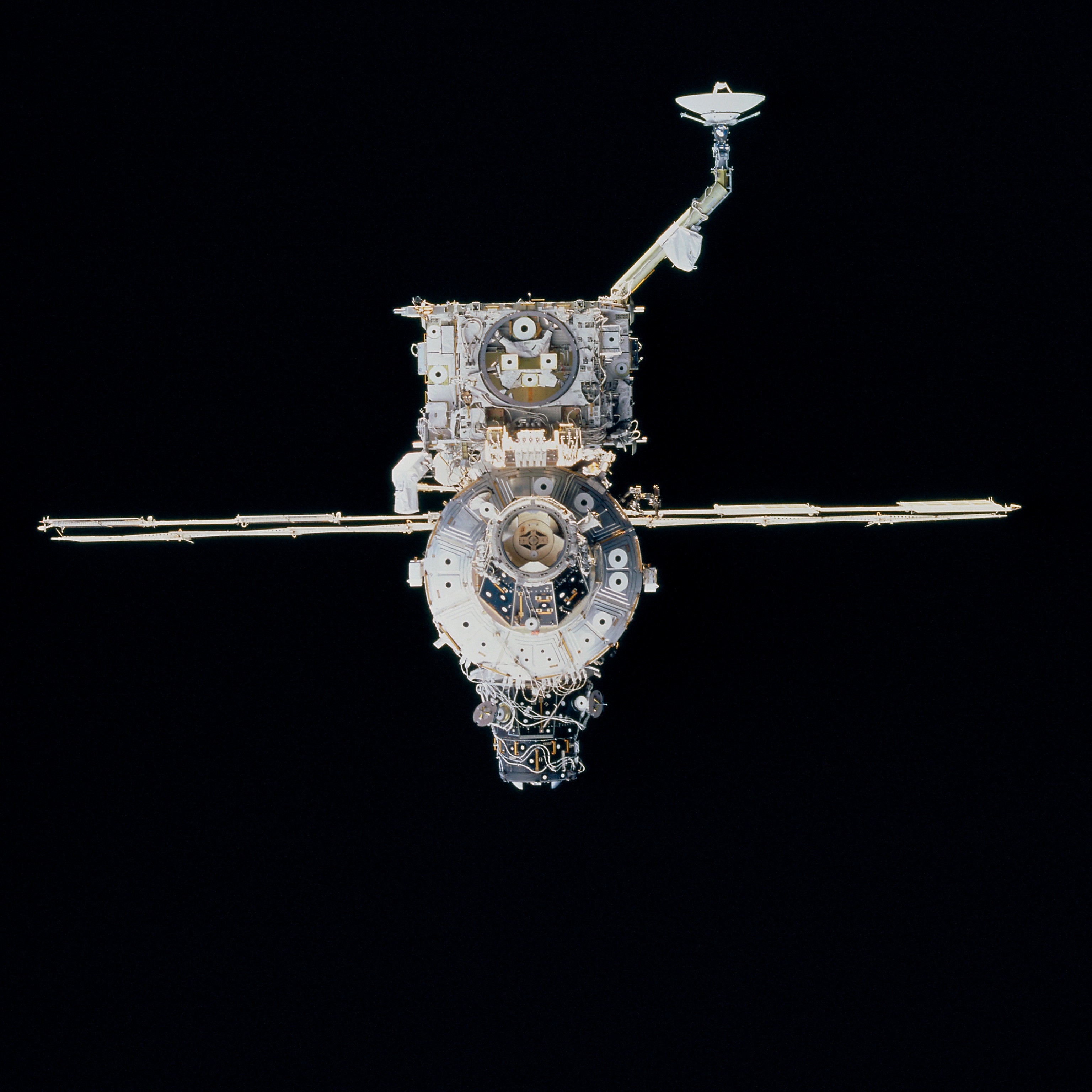 The space station as seen from Discovery shortly after undocking, showing the Z1 Truss with the Space-to-Ground Antenna at top and the third Pressurized Mating Adaptor at bottom.