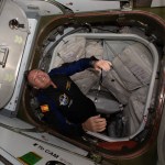 Axiom astronaut Michael E. Lopez-Alegria floats into the space station during the Ax-1 mission