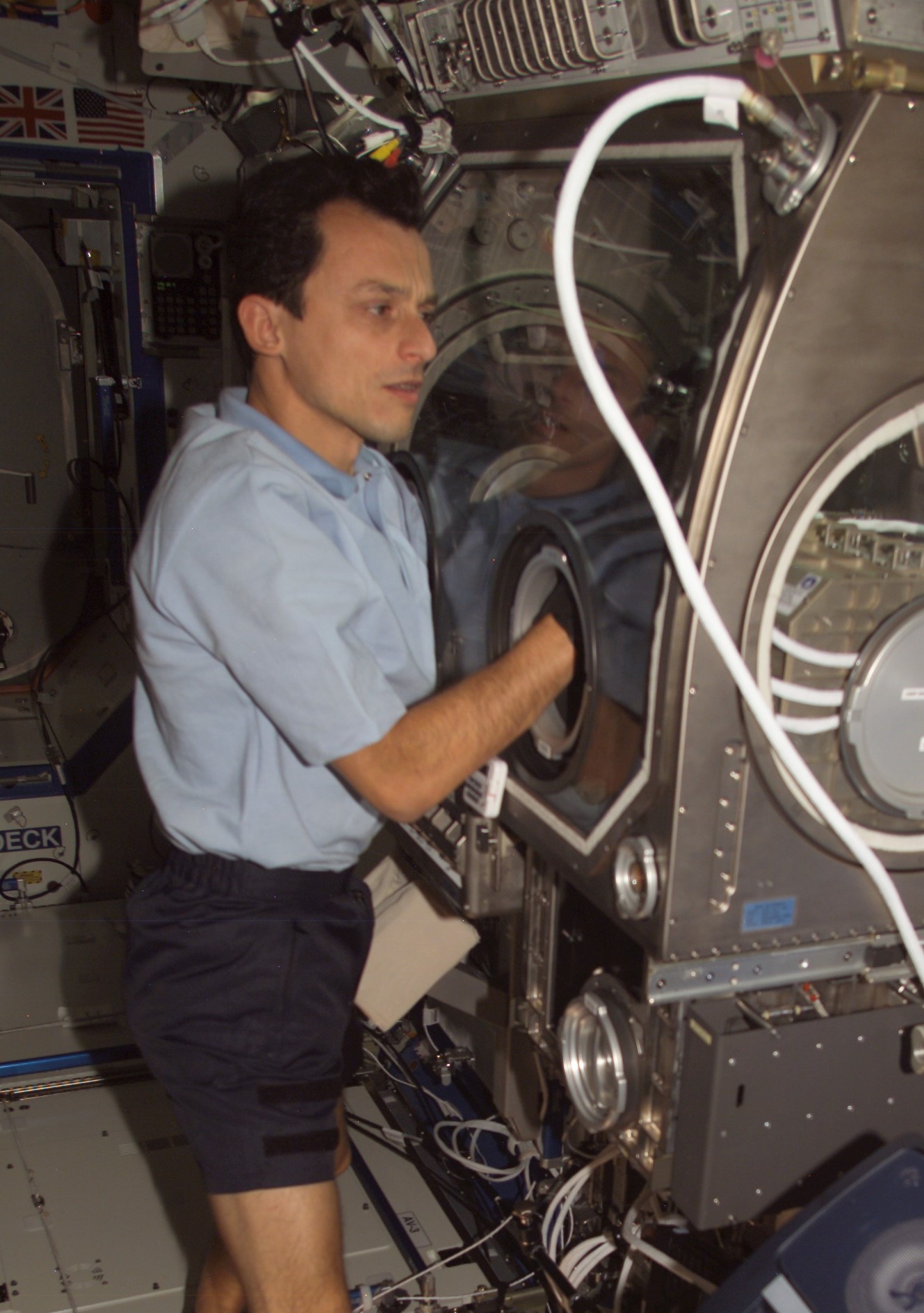 Duque conducting an experiment in the Microgravity Science Glovebox aboard the space station