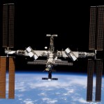 The space station as seen by the departing STS-117 crew, showing the new set of starboard solar arrays at right.