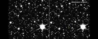 A black background with stars and circle showing where Lucy is at.