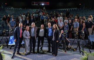 (From left) William Harris, President and CEO of Space Center Houston, Dina Contella, Steve Stich, Gary Jordan, Steve Koerner, and Angela Hart all pose for a photo with the crowd during HWHAP's 300th Episode Live Recording.