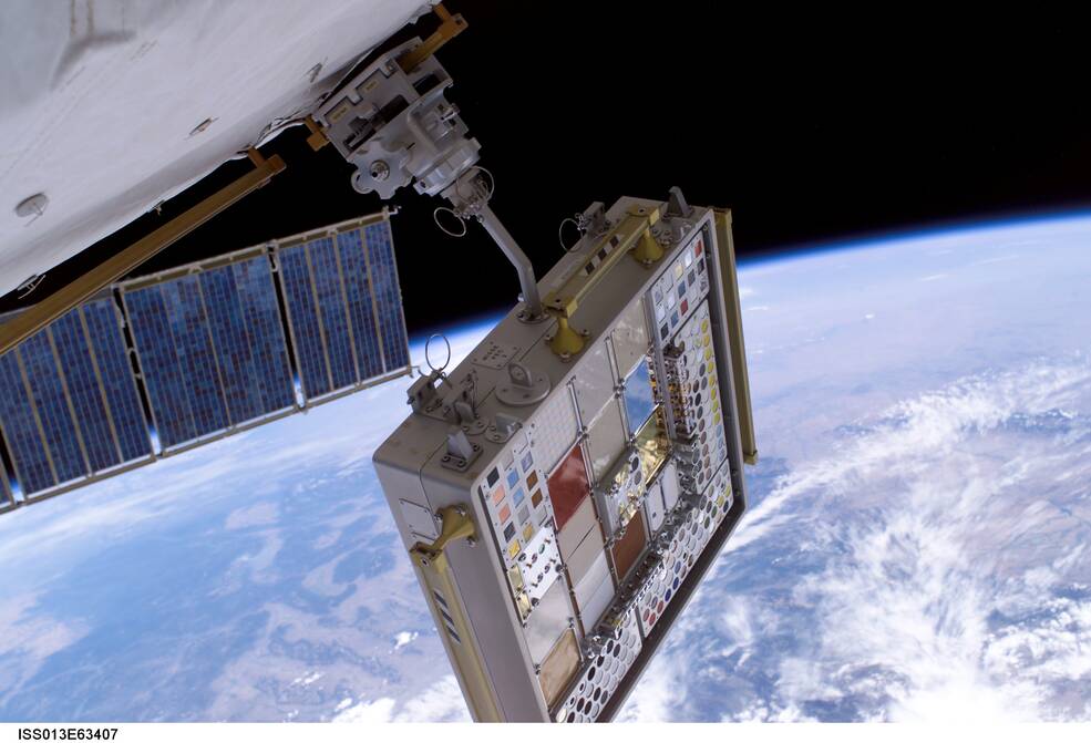 Materials International Space Station Experiment (MISSE) Passive Experiment Container 3 (PEC 3), a rectangular box with samples of different materials is connected to the outside of the station.