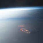 Earth Observation taken during a day pass by the Expedition 40 crew aboard the International Space Station (ISS). Folder lists this as: Afterglow on clouds. Also sent as Twitter message: Sun highlights a storm from underneath.