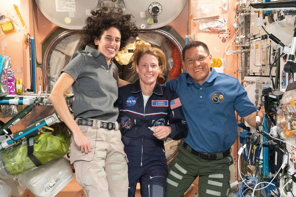 Expedition 69 flight engineers pose for a portrait