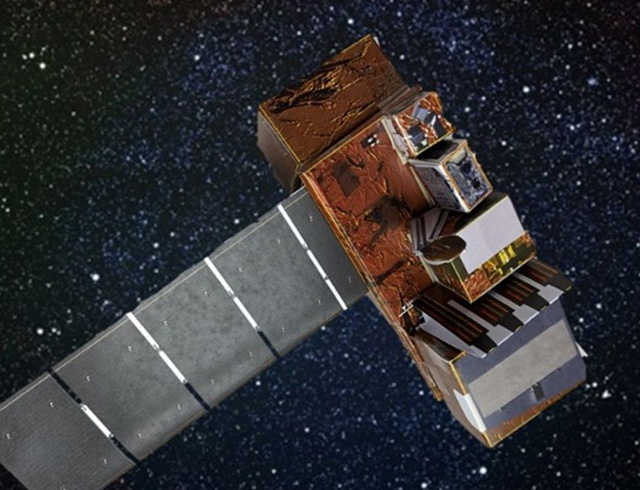 A paper satellite model is shown against a starry background